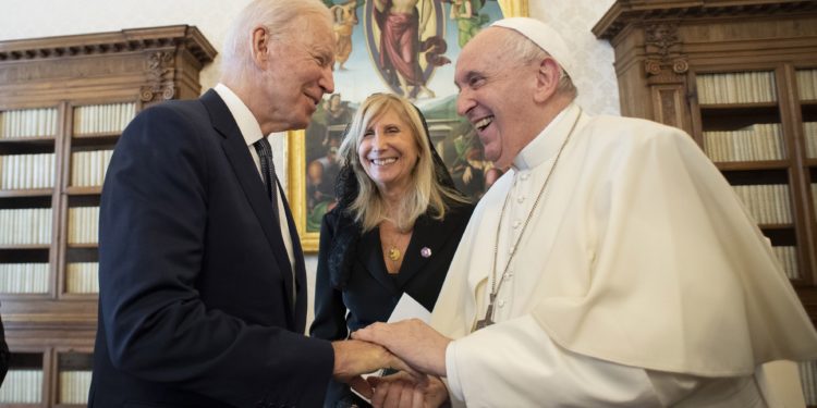 President Joe Biden receives Communion at Mass in Rome