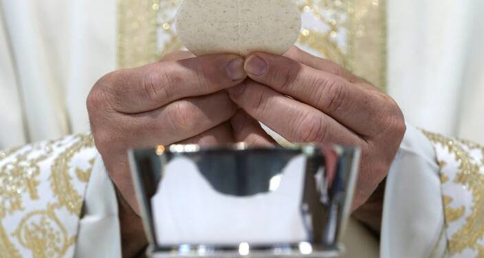 What do Catholics mean when we say the Eucharist is ‘the true body and blood’ of Christ?