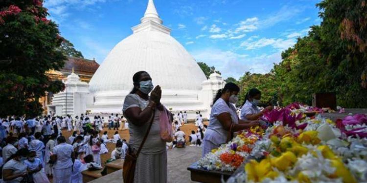 Sri Lankans celebrate Buddhist festival at protest site