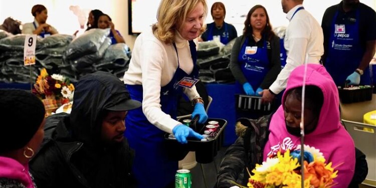 Catholic Charities gives Thanksgiving meals, winter coats to people in need