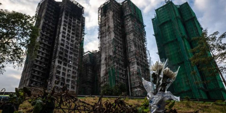 Hong Kong fire death toll hits 159, mourners demand truth