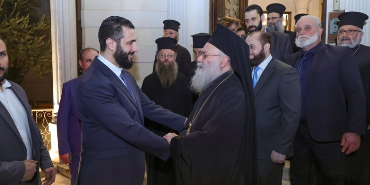 Syrian transitional president visits Greek Orthodox Patriarch John X Yazigi in Damascus